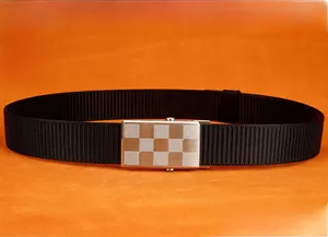 Close-up of brushed stainless steel automatic buckle on a black nylon belt
