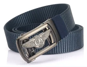 Close-up of matte metal automatic buckle with lion logo and textured navy nylon belt