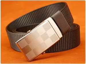 Detail of nylon woven belt featuring a silver metal automatic buckle with grid pattern