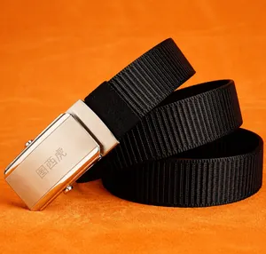 Detail of silver brushed stainless steel buckle with thick black nylon belt strap