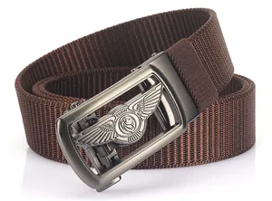 Macro view of brown woven nylon belt with a detailed lion emblem on the metal buckle