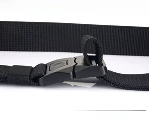 Detail of high-density nylon tactical belt with matte quick-release buckle and TUSHI logo