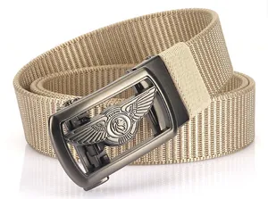 Close-up of TUSHI khaki nylon belt with matte grey buckle and embossed logo detail