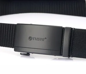 Close-up of zinc alloy quick-release buckle with lion logo on black nylon belt