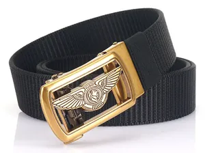 Detail of a golden lion buckle on a premium black nylon woven automatic belt for men