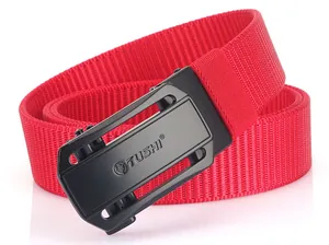 Detail of red nylon canvas belt with a black matte automatic buckle featuring a lion logo