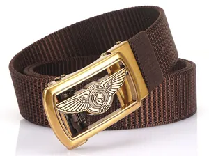 Detailed macro view of the gold lion buckle on a premium brown nylon woven men's belt
