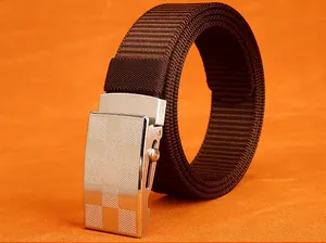 Detail of dark brown woven nylon belt with a textured silver checkered metal buckle
