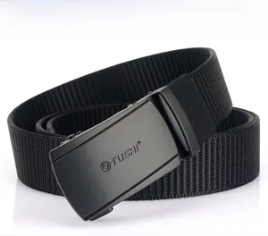 Close-up of matte black metal buckle with tactical nylon canvas belt texture details