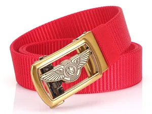 Macro shot of red nylon woven belt with a golden automatic buckle and engraved logo