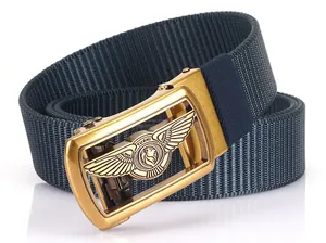 Detailed macro view of navy blue nylon webbing with a gold lion relief automatic buckle