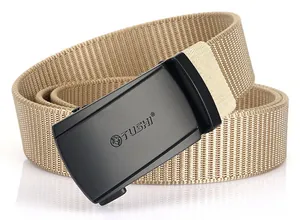 Close-up of khaki nylon tactical belt featuring a matte black buckle with TUSHI engraving