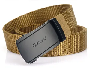 Detailed close-up of tactical nylon belt buckle with engraved lion logo on matte metal