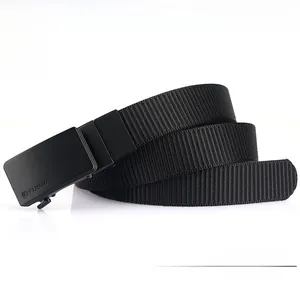 Detail of durable black nylon belt with matte automatic buckle and TUSHI logo engraving