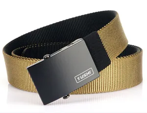 Detail of double-sided khaki and black nylon woven belt with matte black buckle
