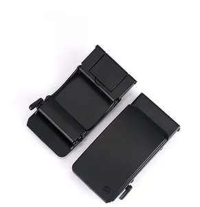 Macro view of matte black zinc alloy automatic belt buckle with laser-engraved TUSHI logo