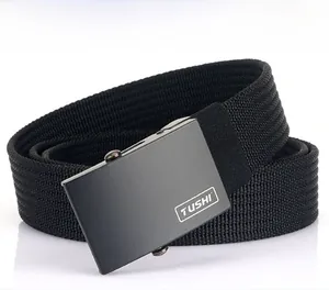 Detail of black woven canvas belt featuring matte metal buckle and TUSHI logo