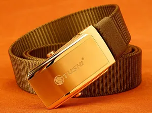 Detail of golden lion buckle with brushed finish on dark brown nylon woven belt