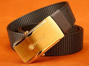 Detail of a brown nylon tactical belt with a brushed gold slider buckle featuring lion logo