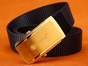 Detail of blue nylon belt with golden metal automatic buckle and lion logo engraving