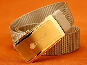 Detail of golden brushed stainless steel buckle on khaki woven nylon outdoor belt