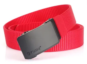 Detailed close-up of the black matte automatic buckle on a red woven nylon belt