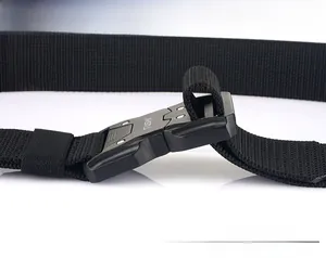 Close-up of matte black quick-release tactical buckle and durable nylon weaving