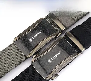 Detail of nylon braided belts with textured automatic buckles and lion logo engraving