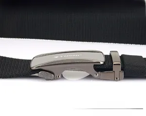 Detail of adjustable woven nylon belt featuring a gray metal automatic buckle by TUSHI
