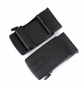 Detailed macro view of black zinc alloy automatic belt buckle with matte textured finish