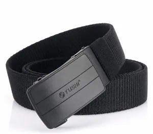Close-up of black nylon elastic belt with matte automatic buckle and TUSHI logo