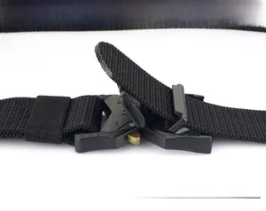 Detail of metal quick release buckle showing adjustable length mechanism on nylon belt
