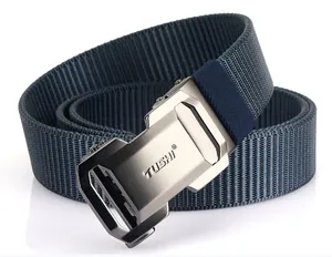 Macro detail of navy blue nylon woven belt with a matte silver metal buckle by TUSHI