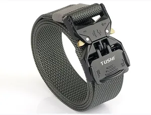 Detail of olive green tactical nylon belt showing heavy-duty metal quick release buckle