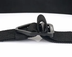 Detail of matte black tactical buckle and nylon webbing with adjustable length