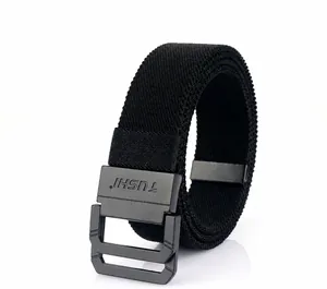 Close-up of black elastic woven canvas belt with matte metal buckle and textured strap