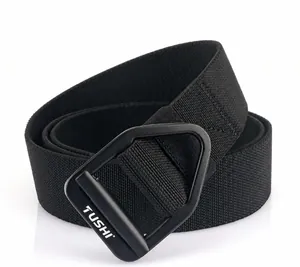 Detail of a black woven tactical belt with a matte metal buckle and TUSHI branding logo