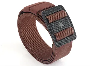 Detail of coyote brown nylon tactical belt showing the black star buckle texture
