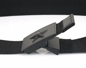 Detail of matte black tactical buckle with star emblem and adjustable nylon belt strap