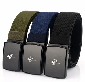Detail of nylon stretch belts with engraved black metal buckles in three colors