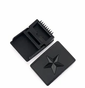 Close-up of matte black zinc alloy belt buckle with star relief and durable texture