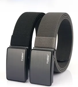 Detail of high-density nylon belts with matte metal buckle and textured finish