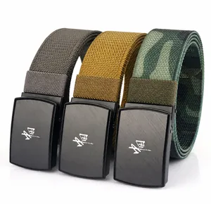 Detail of canvas belts with zinc alloy buckles and stretch nylon webbing in multiple colors
