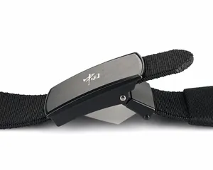 Close-up of black canvas belt featuring a matte metal buckle with China character