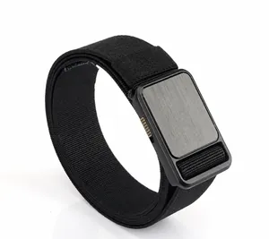 Detail of black elastic nylon belt with brushed grey metal buckle and TUSHI logo