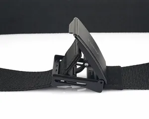 Detail of adjustable black matte buckle with nylon webbing texture on casual belt
