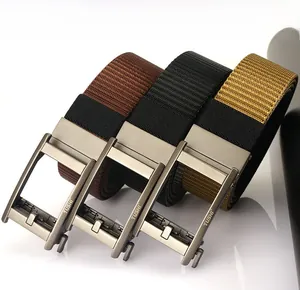 Detail of high-density nylon belts with matte automatic buckles and engraved logo