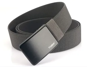 Detailed close-up of dark grey nylon canvas belt with a brushed metal buckle and TUSHI logo