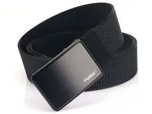 Detail shot of the black brushed metal buckle with white TUSHI logo on nylon canvas belt