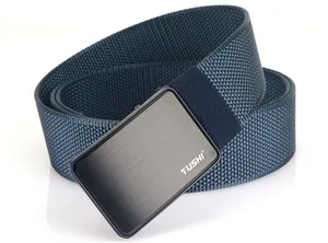Detail of navy nylon canvas belt with brushed metal buckle and TUSHI logo engraving